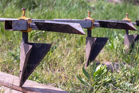 Agricultural manual metal plow on the field. Plowing the land before sowing. Close-up. Inventory ...