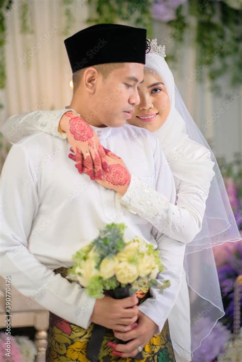 Indoor shooting for Malay wedding, the bride and groom wearing Malay traditional cloth in ...