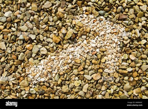 arrow symbol in pebbles Stock Photo - Alamy