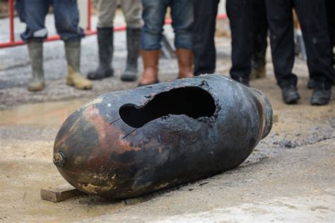 How a 1,000-pound WWII bomb was pulled out of the ground without ...