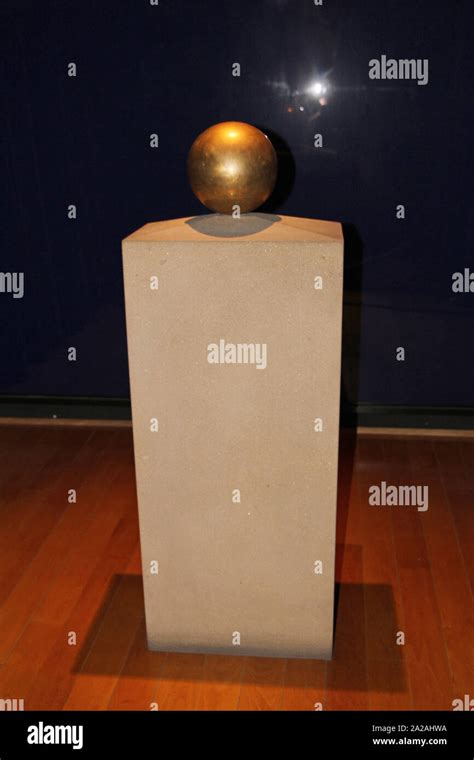 Golden sphere urn containing Nikola Tesla's ashes on display stand, Nikola Tesla Museum, Serbia ...