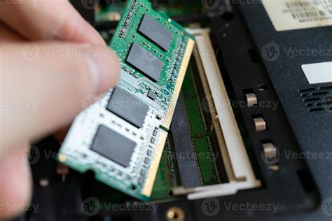 Repairmen are replacing ram for laptop 4797659 Stock Photo at Vecteezy