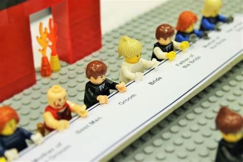 lego people are sitting on a long line of paper with the names of their ...