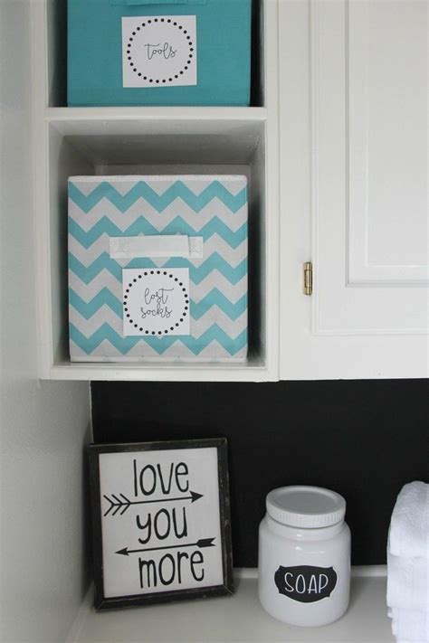 bathroom storage with blue and white chevron boxes