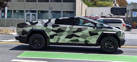 Tesla Cybertruck with new darker camouflage wrap spotted | Electrek