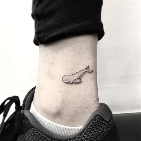 Beluga tattoo on the ankle.