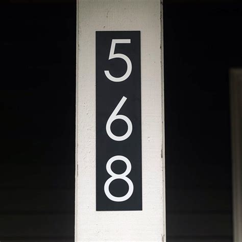 This black and white metal modern address sign is perfect to help display your address! Multiple ...