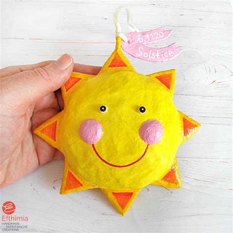 Efthimia: Happy and smiling paper mache sun ornaments