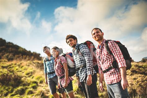 Group Of People Hiking On The Mountain Stock Photo | Royalty-Free ...