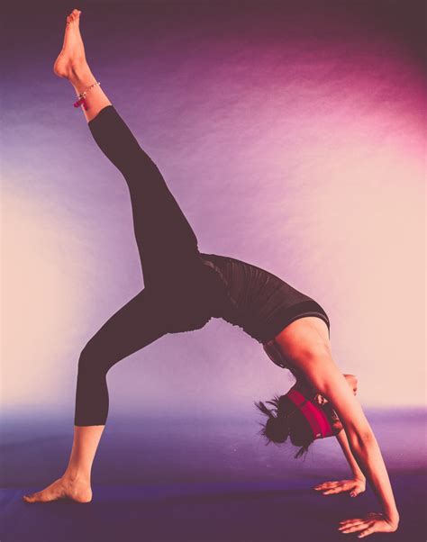 Woman Doing Back Bridge Pose With One Leg Raised