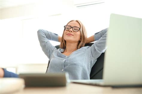 Young Businesswoman Relaxing at Workplace in Office Stock Image - Image of beautiful, employee ...