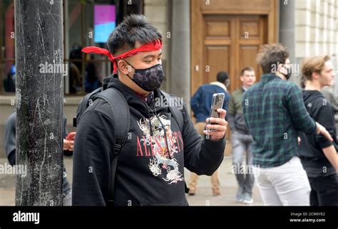 Asian man in red bandana & face mask Stock Photo - Alamy