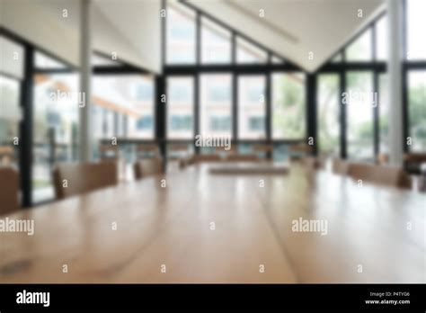 cafe coffee shop cafeteria blur defocused background with wood table for display montage product ...