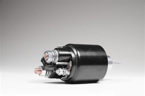 Starter solenoid for car on gray background. Auto parts 2883254 Stock Photo at Vecteezy