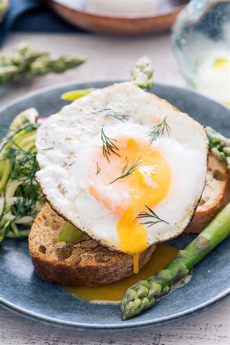 "Lunch: Fried Duck Egg With Asparagus On Toast." by Stocksy Contributor ...