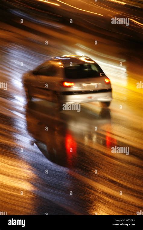 fast car driving in heavy rain at night in town Stock Photo - Alamy