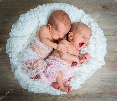 Newborn twins l sleeping in a basket — Stock Photo © tan4ikk #80840130