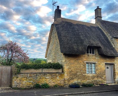 This cozy thatched roof cottage in a tiny British village stole my ...