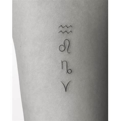 Minimalistic style zodiac symbols tattooed on the inner