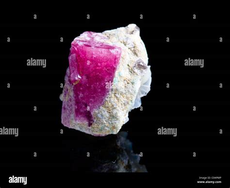 Red beryl crystal on matrix Stock Photo - Alamy