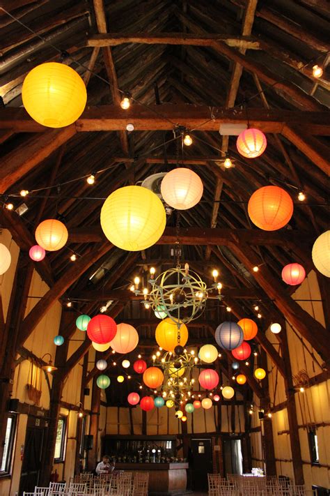 Illuminated coloured paper lanterns look incredible in dark, high barn venues! Illuminate your ...