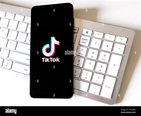 Mobile phone device showing TikTok logo on screen Stock Photo - Alamy