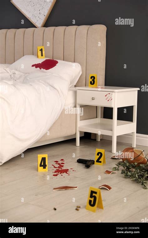 Crime scene markers and evidences in bedroom Stock Photo - Alamy