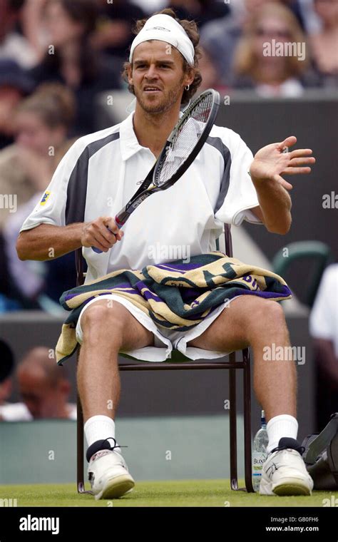 Gustavo kuerten checks his racket during a change over hi-res stock photography and images - Alamy