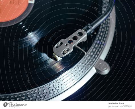 Vintage turntable with playing vinyl phonograph record - a Royalty Free ...