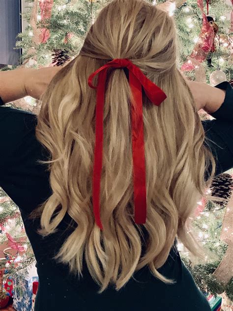 Red ribbons are the perfect way to create a festive holiday hairstyle. I am wearing a halo hair ...