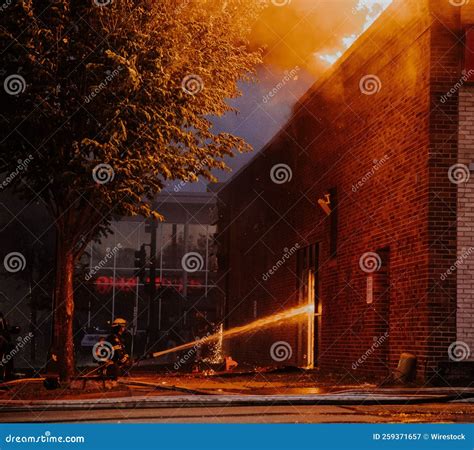 Firefighter Extinguishing a Fire during the George Floyd Riots of 2020 ...