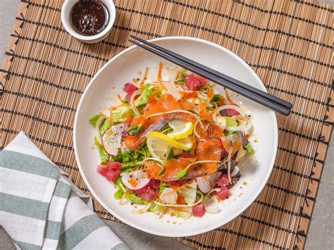 Raw Fish Salad with Salmon, Tuna and Japanese Dressing Stock Image - Image of dish, food: 59594913