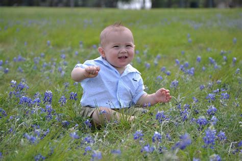 Baby Boy Sitting In Flowers - DesiComments.com