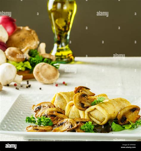 Hot Russian pancakes or blini with mushrooms Stock Photo - Alamy