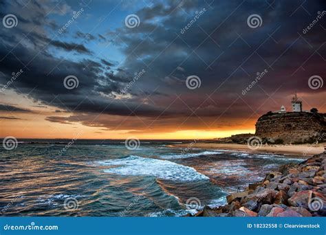 Lighthouse and Ocean Sunset Stock Photo - Image of seascape, light ...