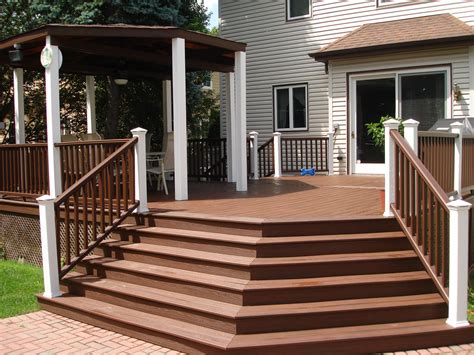 a deck with steps leading up to a gazebo