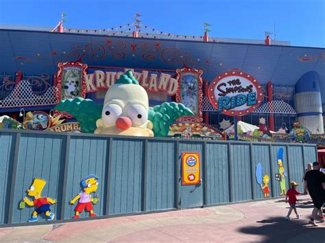 Construction Walls Go Up Around The Simpsons Ride at Universal Studios Florida, Vehicle With ...