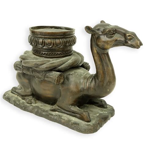 A Bronze Seated Camel Sculpture | Kodner Auctions