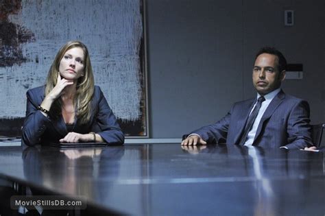 The Firm - Publicity still of Tricia Helfer & Shaun Majumder