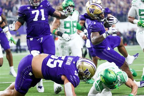 No. 3 UW Huskies rally to beat No. 5 Oregon, secure CFP spot