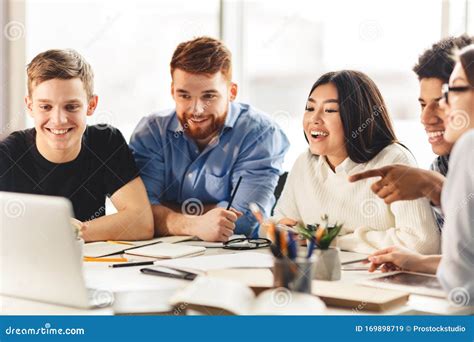 Team of College Students Talking Over Group Project Stock Image - Image of caucasian, campus ...