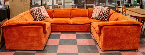 BURNT ORANGE COLOURED U-SHAPED SECTIONAL SOFA