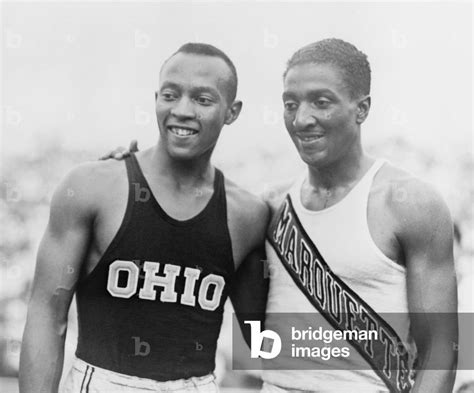 Image of Jesse Owens (1913-1980) with Ralph Metcalfe (1910-1938) teammates and rivals