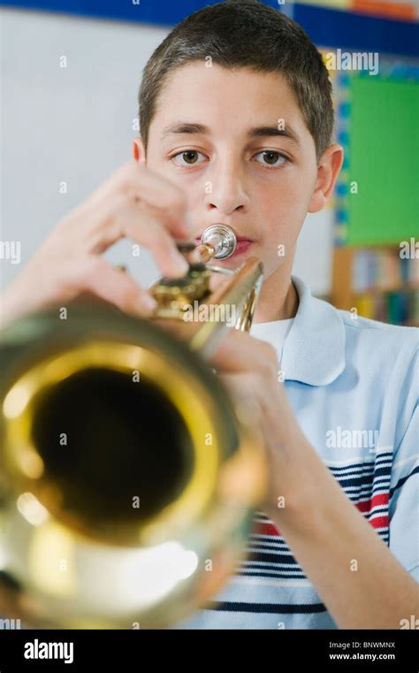 Elementary school student playing trumpet Stock Photo - Alamy