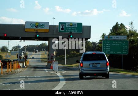 Florida Turnpike highway toll booths with SunPass lanes during the ...