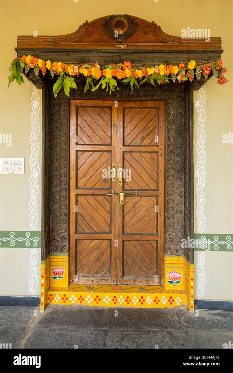 Painted entrance door of traditional Indian home with flowers and leaves Stock Photo - Alamy