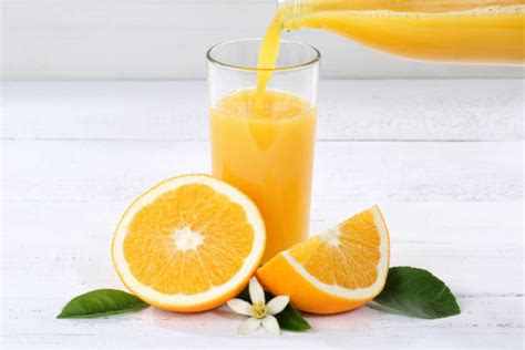 Top 60 Pouring Orange Juice Stock Photos, Pictures, and Images - iStock