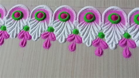 a row of pink and white flowers with green centers