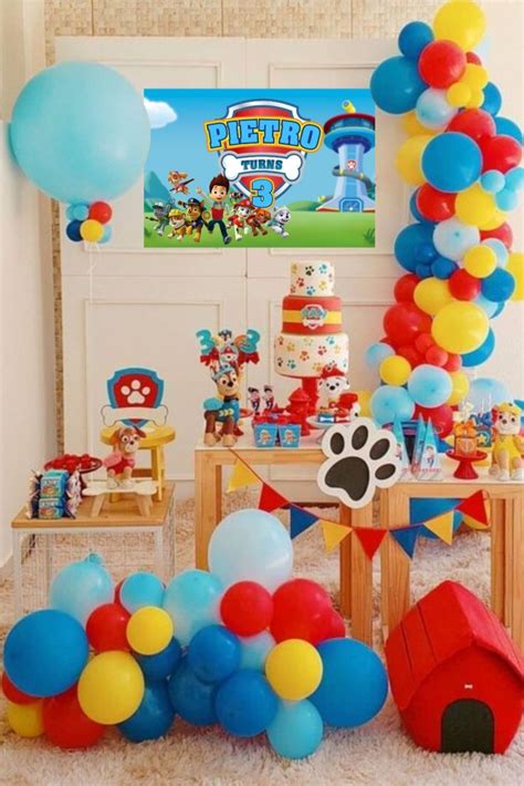 the birthday party is decorated with balloons and paw patrol ...