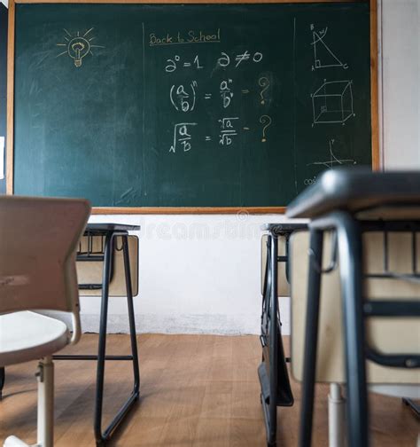 Empty Classroom with Chairs Elementary School Desks and Chalkboard ...